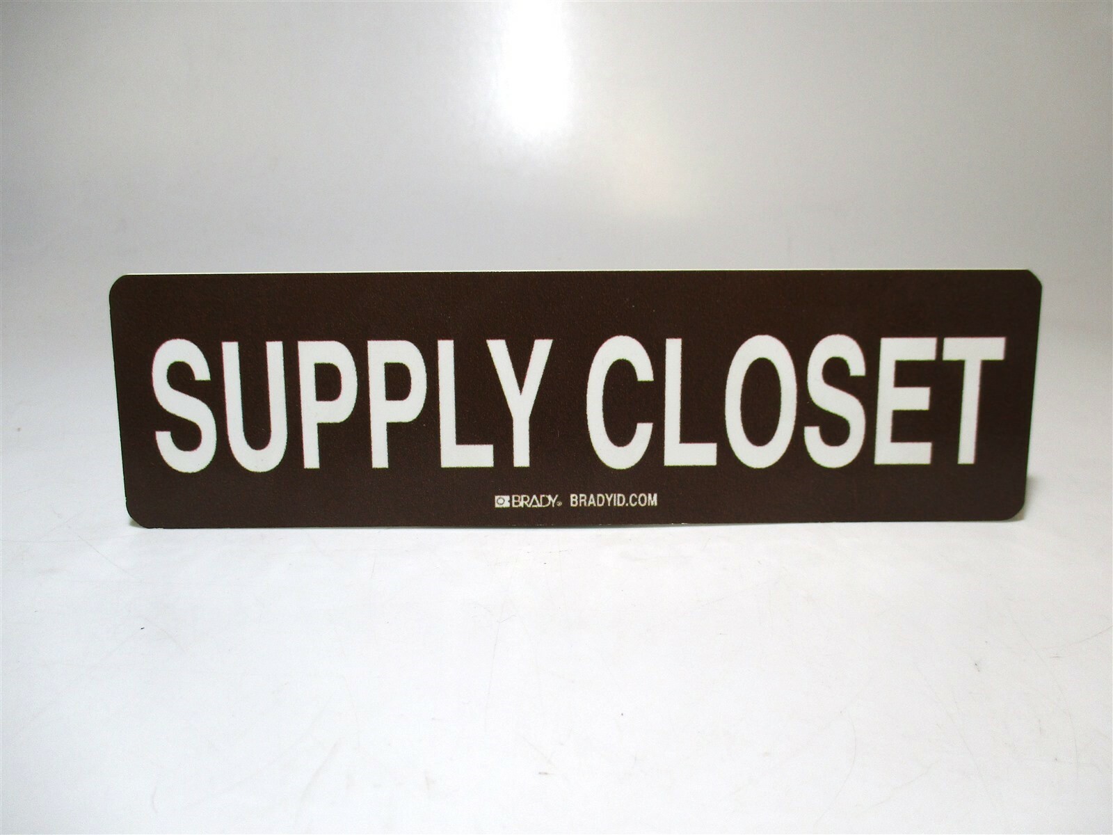 Brady High Quality Rigid Polystyrene « Supply Closet » White/Brown 9&Prime; x 2.5&Prime; Sign