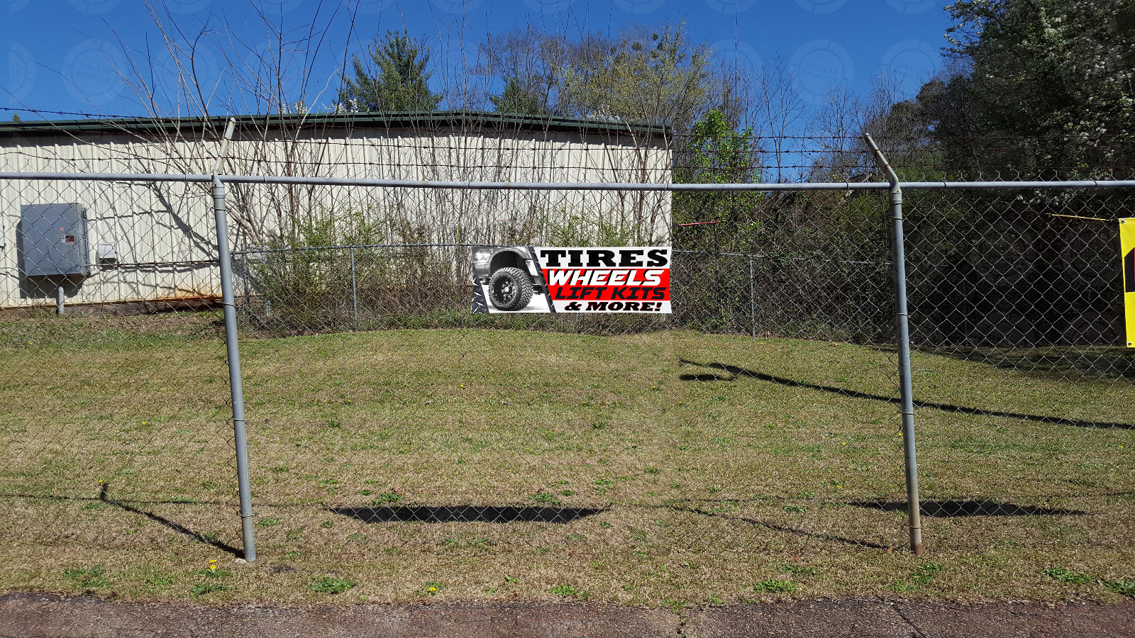 TIRES WHEELS LIFT KITS & MORE banner sign displays open auto repairs suspensions