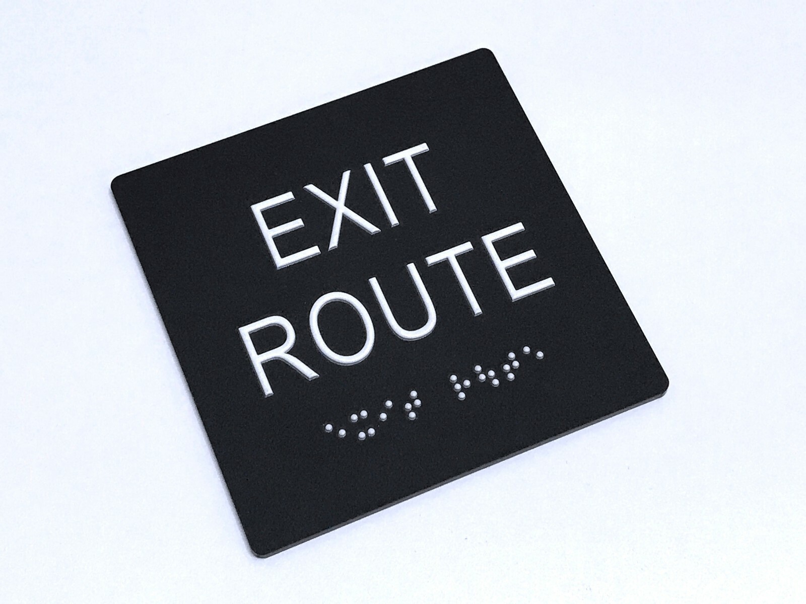 « EXIT ROUTE » ADA / braille sign 4&Prime; x 4&Prime; matte black acrylic w/white tactile 