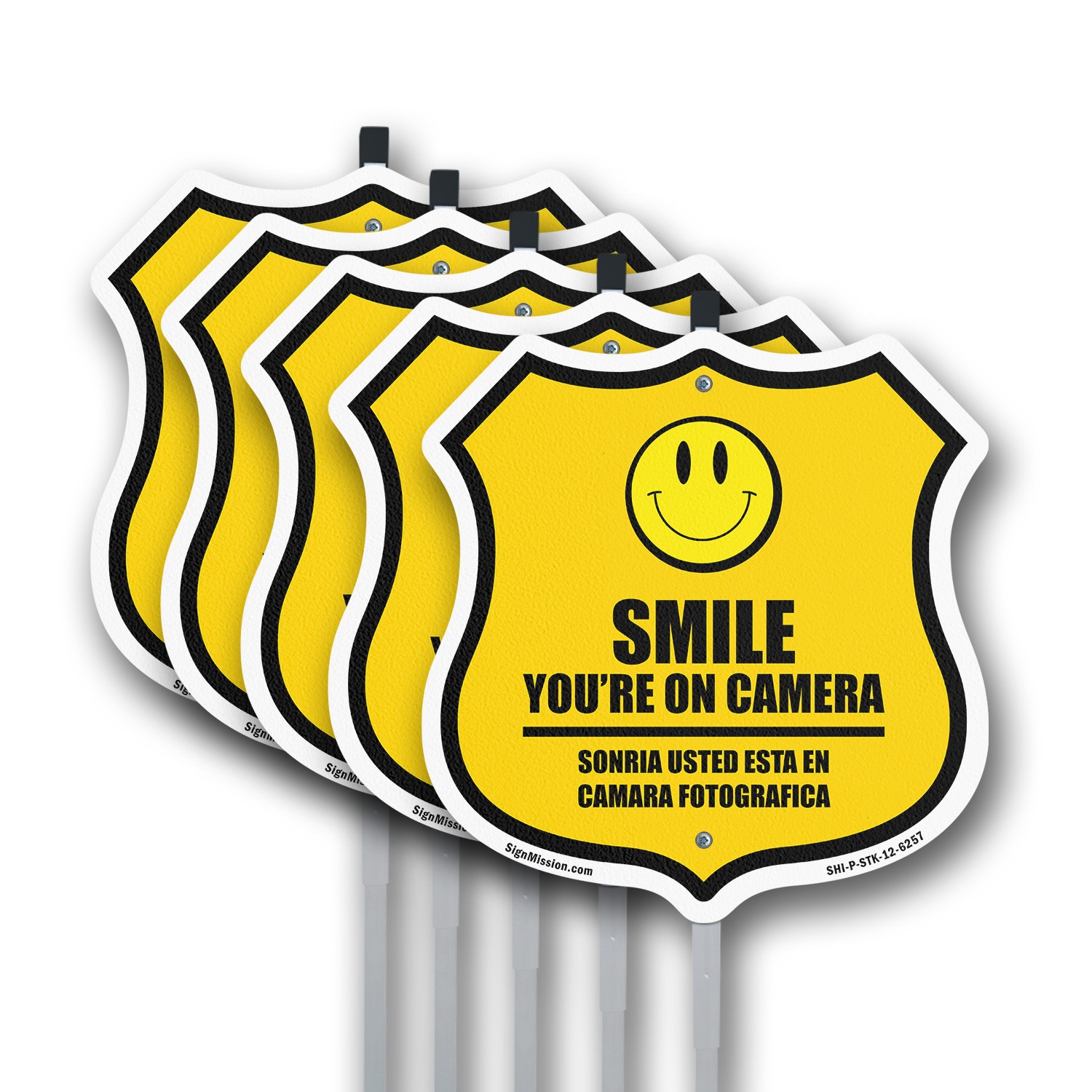 Smile You&rsquo;re On Camera Bilingual English / Spanish Shield Shaped Sign With Stake