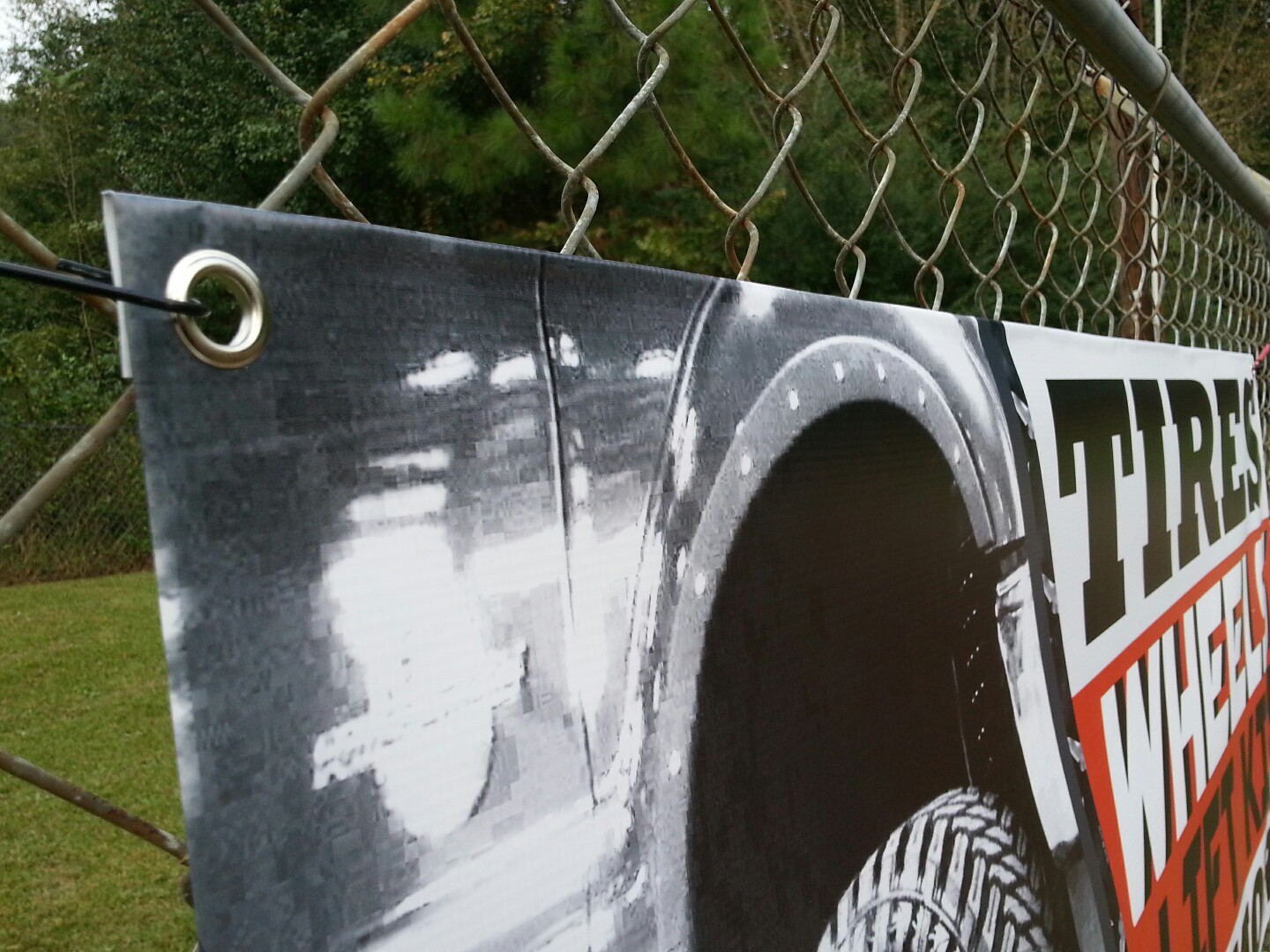 TIRES WHEELS LIFT KITS & MORE banner sign displays open auto repairs suspensions
