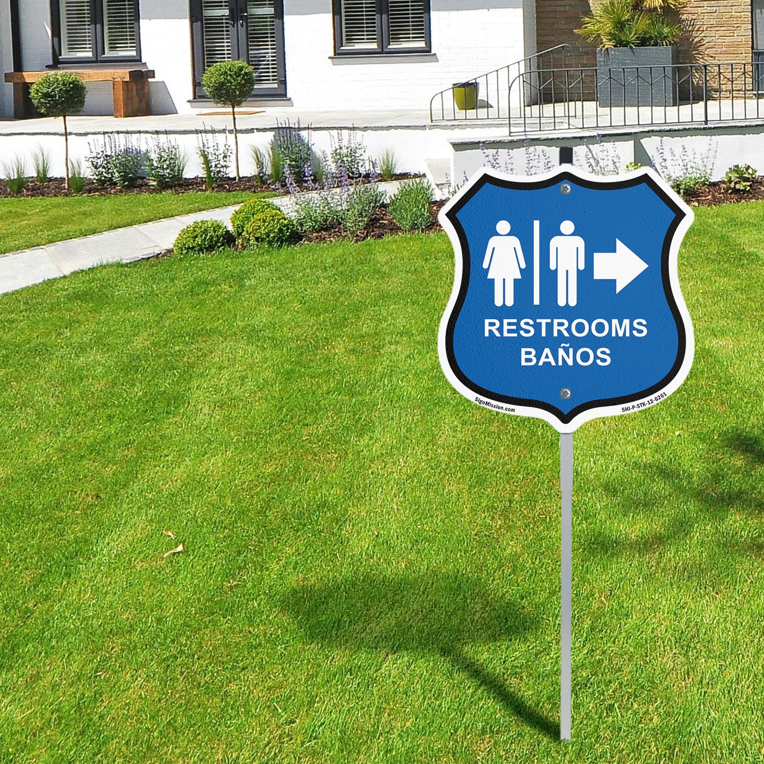Restrooms Ba�os Right Arrow Bilingual English / Spanish Shield Sign With Stake