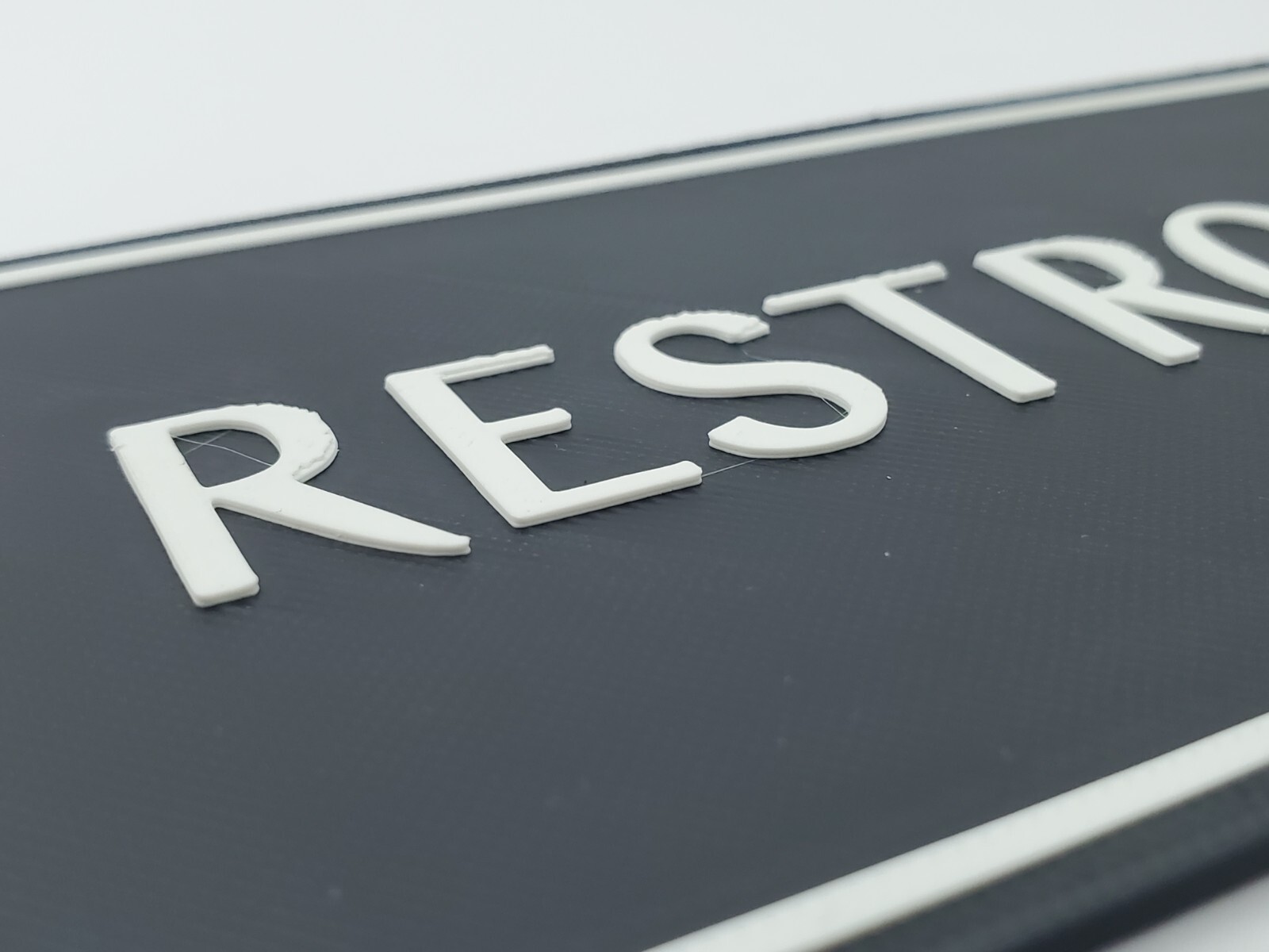 3D Printed Navigation Restrooms Sign 9×3 Inc