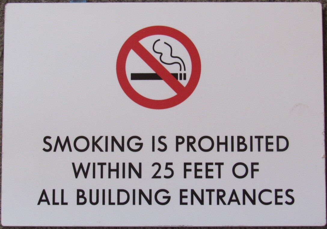 No Smoking Sign White Plastic 7 x 10 inches