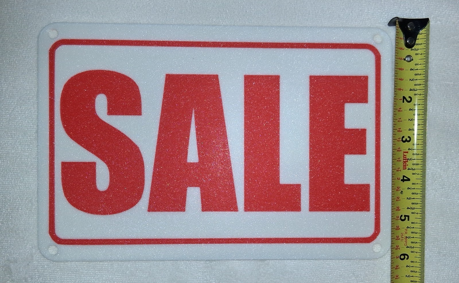 6&Prime; x 9&Prime; SALE Sign. Plastic with mounting holes for screws or « zip ties ».