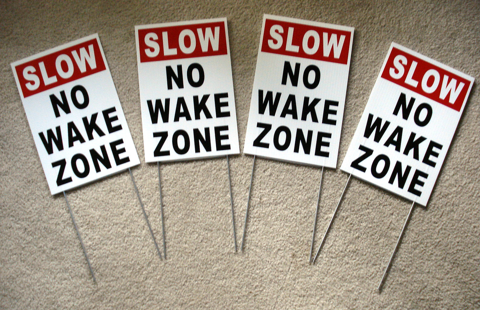 (4) SLOW NO WAKE ZONE 8&Prime; x12&Prime; Plastic Coroplast Signs with Stakes white