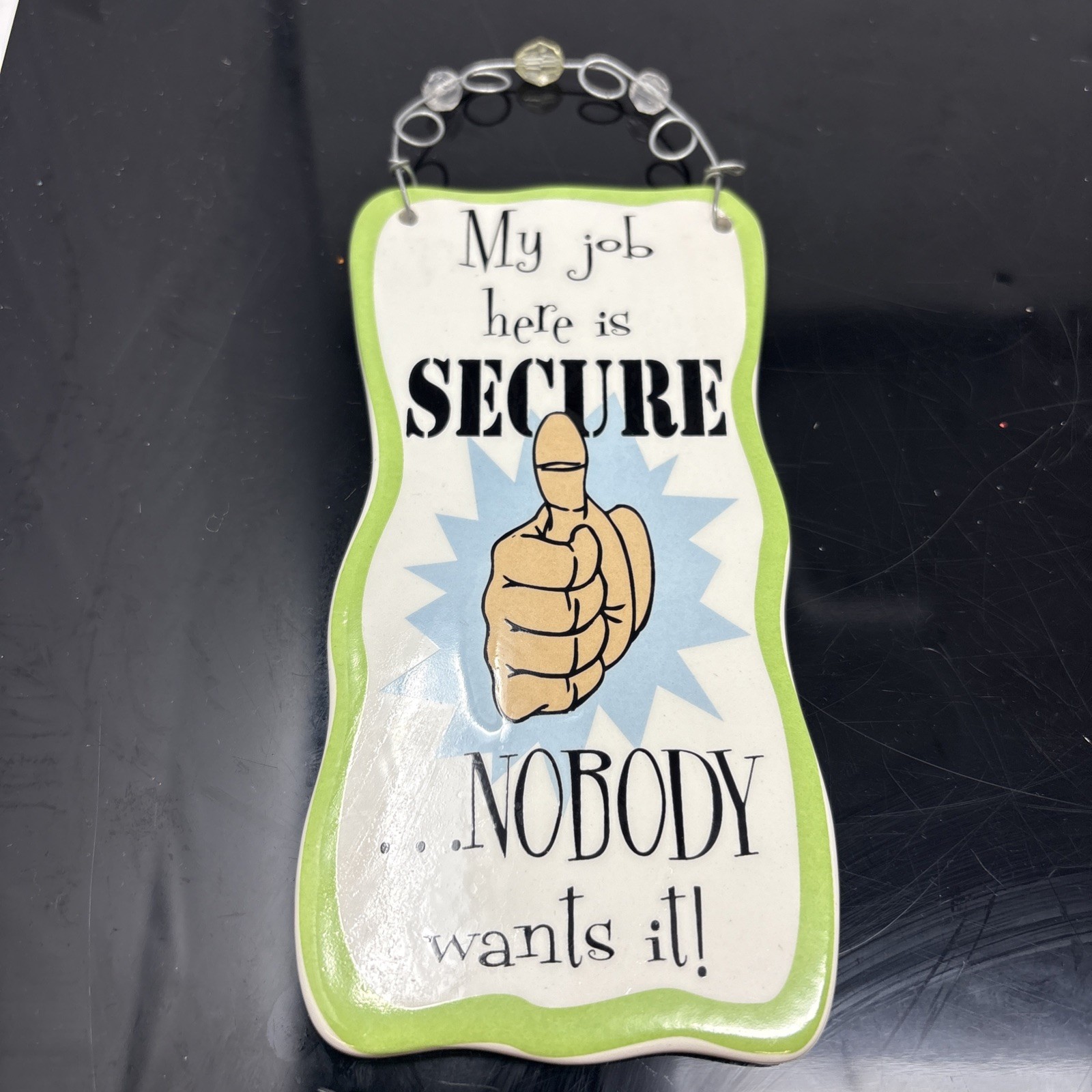 Glazed Ceramic Comical « My Job Is Secure… » Sign – Wire Hanger