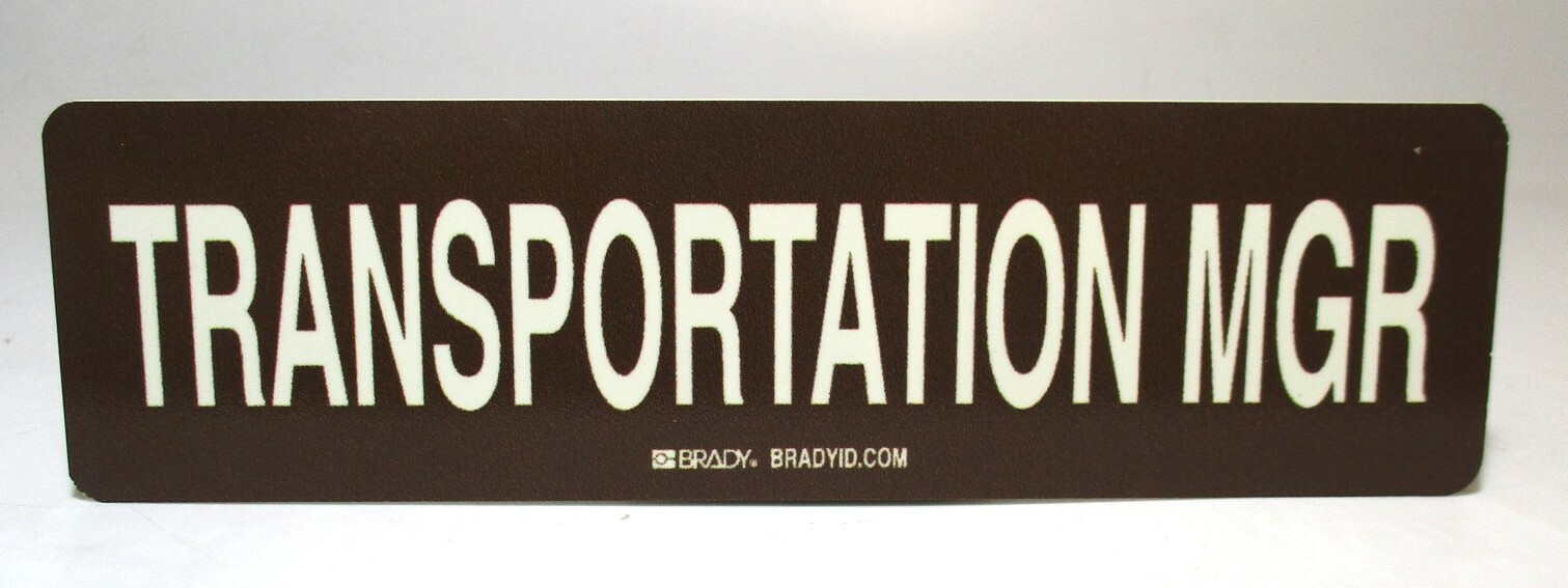 Brady High Quality Rigid Polystyrene « Transportation MGR » Wht/Bwn 9&Prime;x 2.5&Prime; Sign